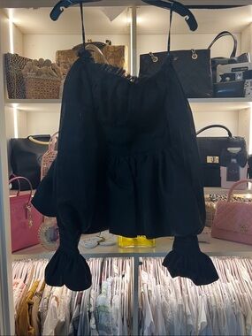 Elegant Aje. Devine Black Peplum blouse.